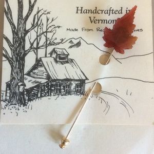 Maple leaf pin.